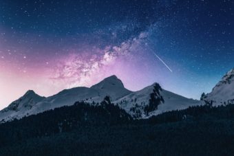 Mountain peaks with what looks like the Milky Way above them.