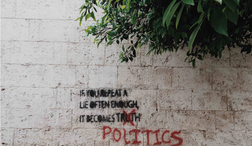 Graffiti about politics on a wall.