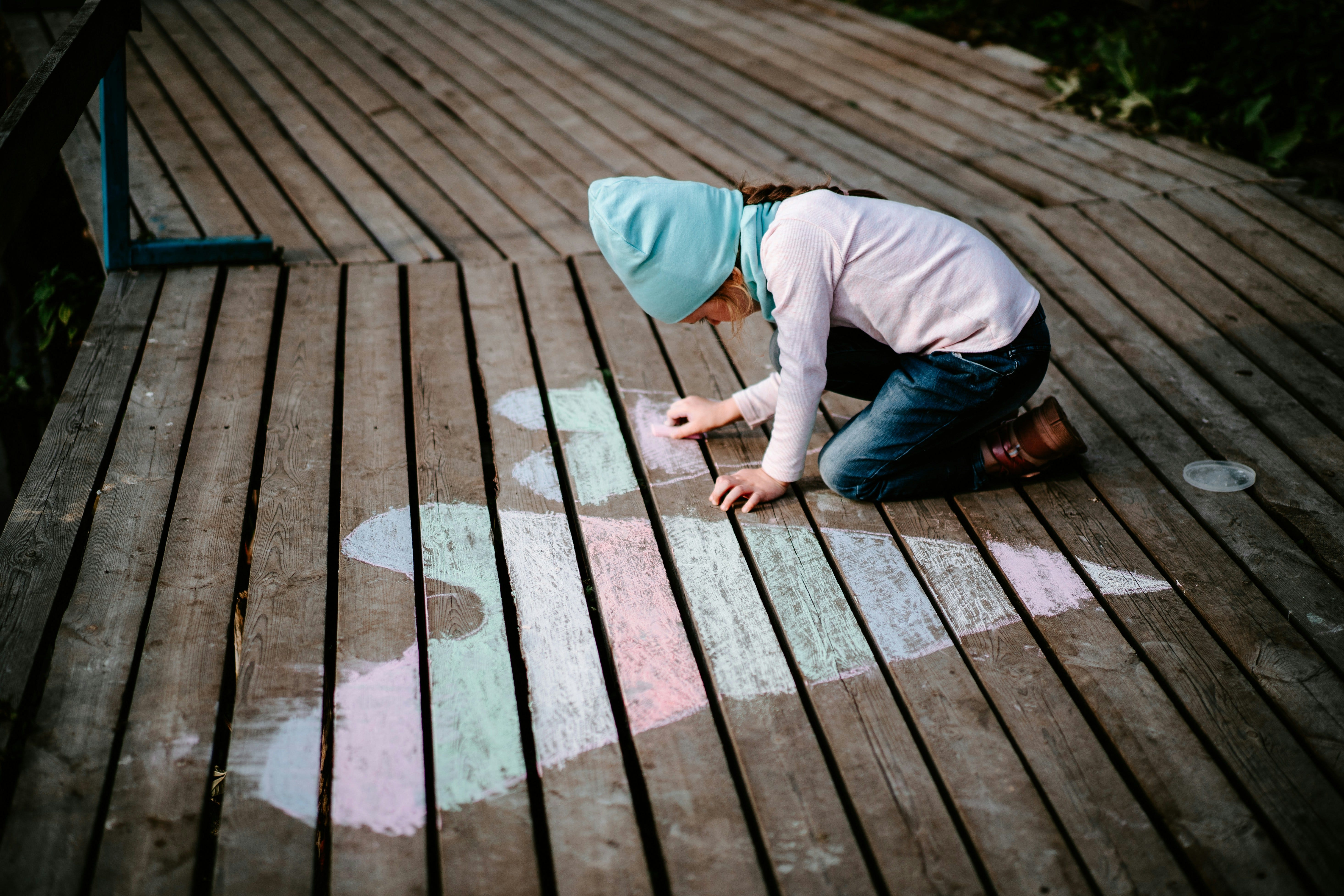 Girl chalk drawing hearts...