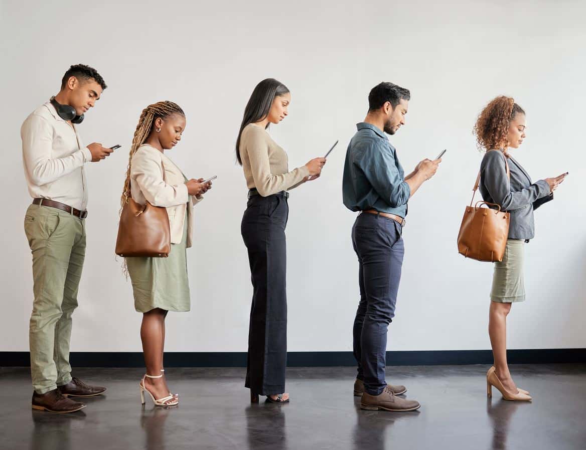 People in line, on their phones