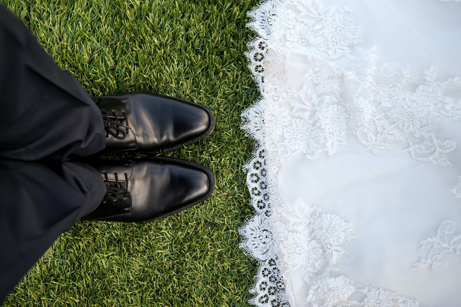 Picture of shoes at a wedding ceremony.